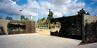The entrance gates are peppered with pixellated holes 