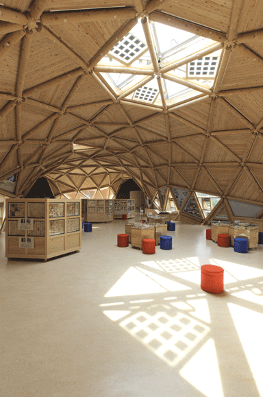 The Japanese cedar truss structure is punctuated by skylights The Japanese cedar truss structure is punctuated by skylights