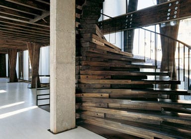 A spiral staircase in solid pine connects the three storeys A spiral staircase in solid pine connects the three storeys