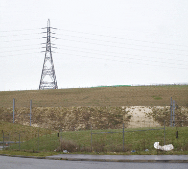 The site of the monument is marked by the green fence; the cutting in the foreground carries the Channel Tunnel rail link The site of the monument is marked by the green fence; the cutting in the foreground carries the Channel Tunnel rail link