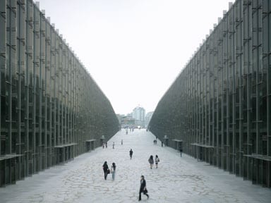 Stainless steel fins punctuate the large glass curtain walls
