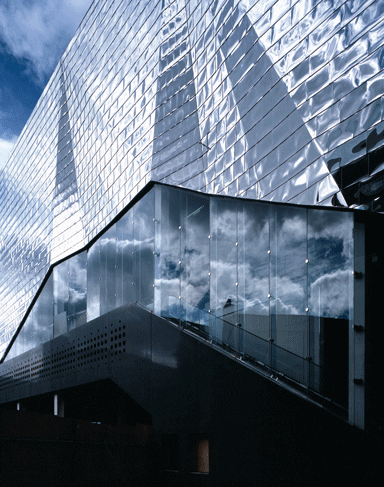 The thin steel that clads the cinema buckles slightly, creating a quilted effect