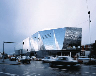 The building bulges out into the street, foreshortening it