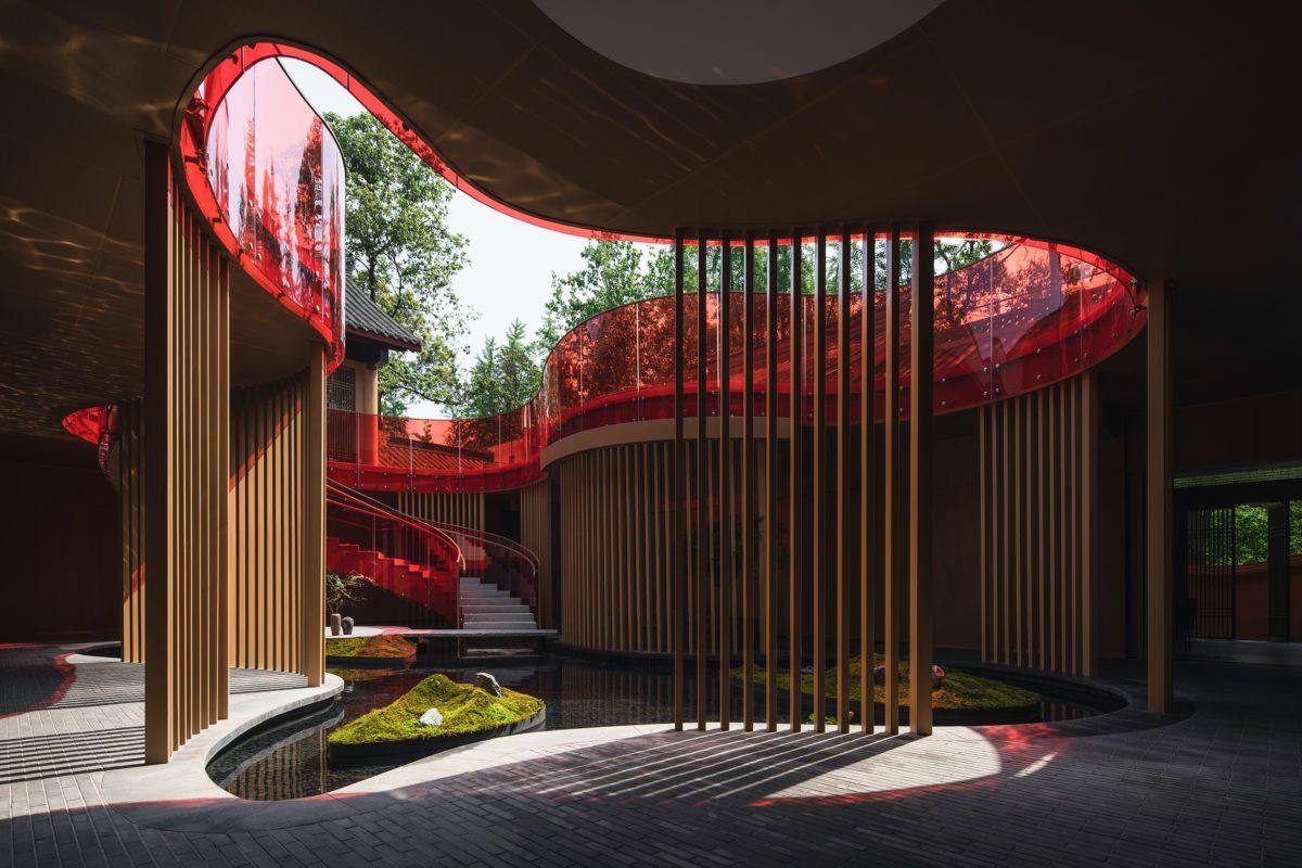 Kuansan Town Restaurant Chengdu China MUDA-Architects China architecture red architecture contemporary architecture woman walking stairs