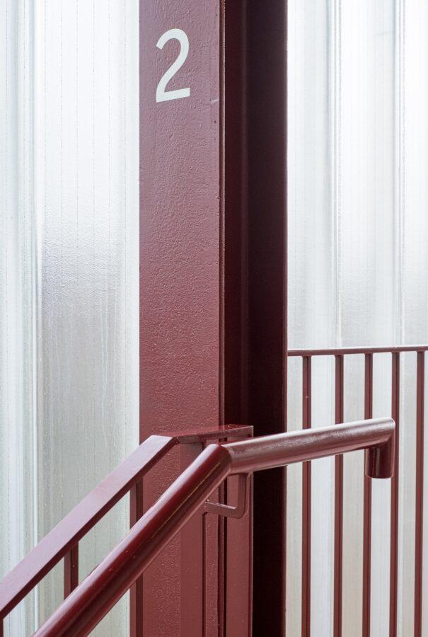 Reed Watts Harbard Close Barking London red staircase detail