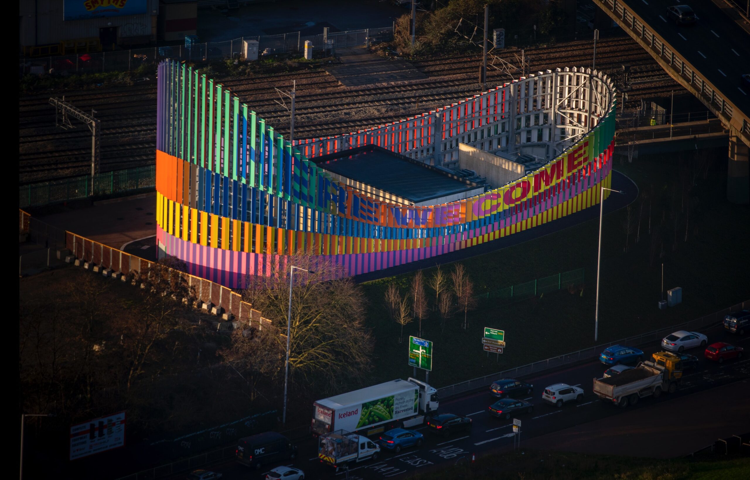 Here we come, here we rise Brent Cross Town substation artwork colourful building IF_DO