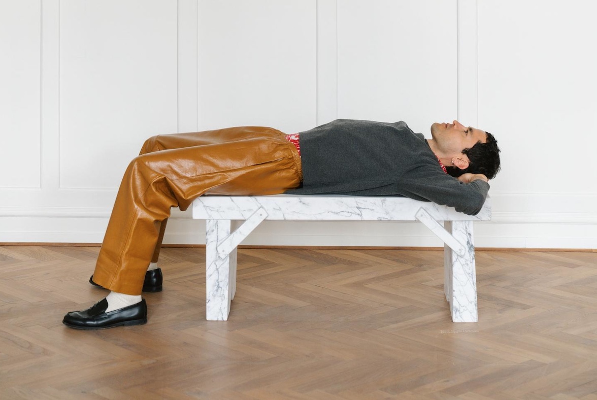 Man on white bench